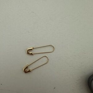Gold clothes pin earrings and stud and a hoop